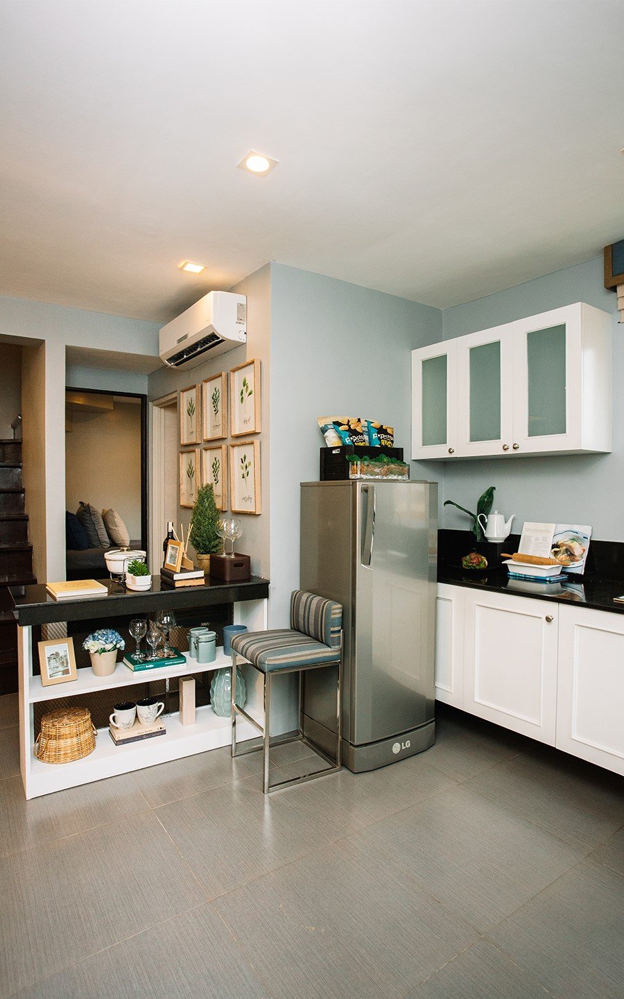 Ella home kitchen area with refrigerator